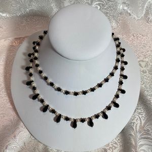 Crystal and pearl double strand necklace.